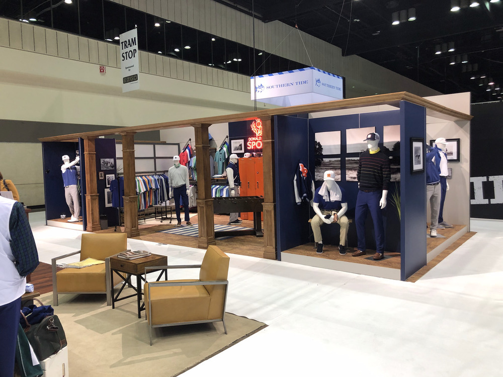 Trade show apparel booth build with multiple room vignettes