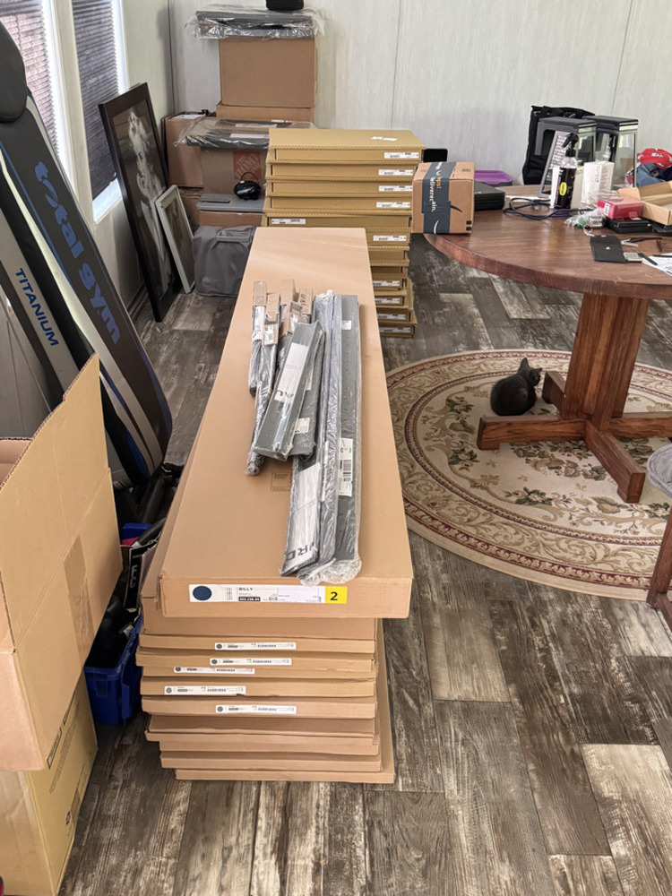 Flat-pack IKEA furniture boxes ready for assembly and install